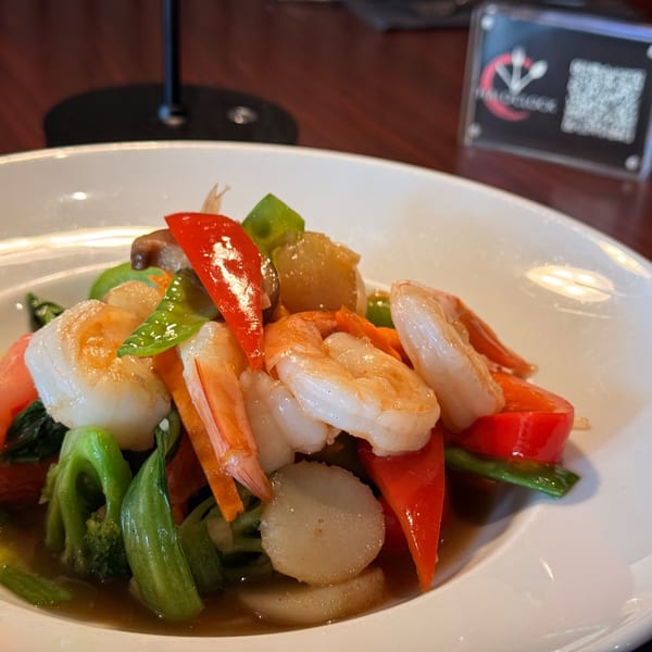 Thai O'Clock's stir-fried shrimp, scallops, and mixed vegetables in a savory sauce.